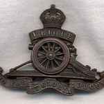 Photo of an Royal Field Artillery cap badge